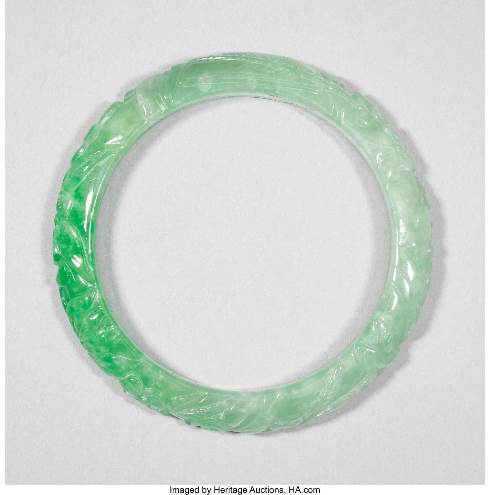 A Carved Jadeite Bangle, 20th century Inner circ (1 of 2)