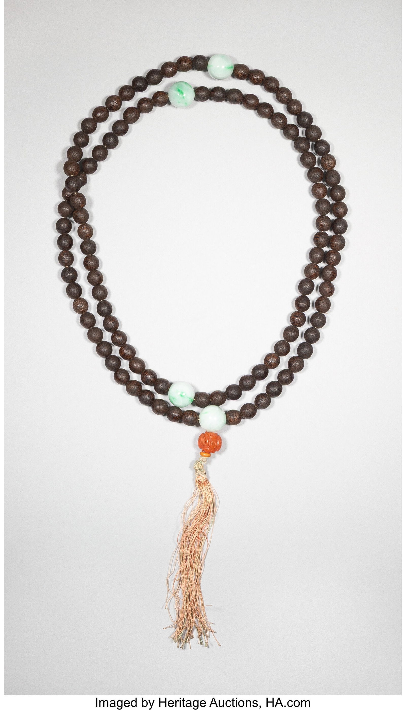 A Chinese Wood and Jadeite Rosary Length: 19-1/2: A Chinese Wood and Jadeite Rosary Length: 19-1/2 inches (49.5 cm) HID03101062020 © 2026 Heritage Auctions | All Rights Reserved www.HA.com/TexasA
