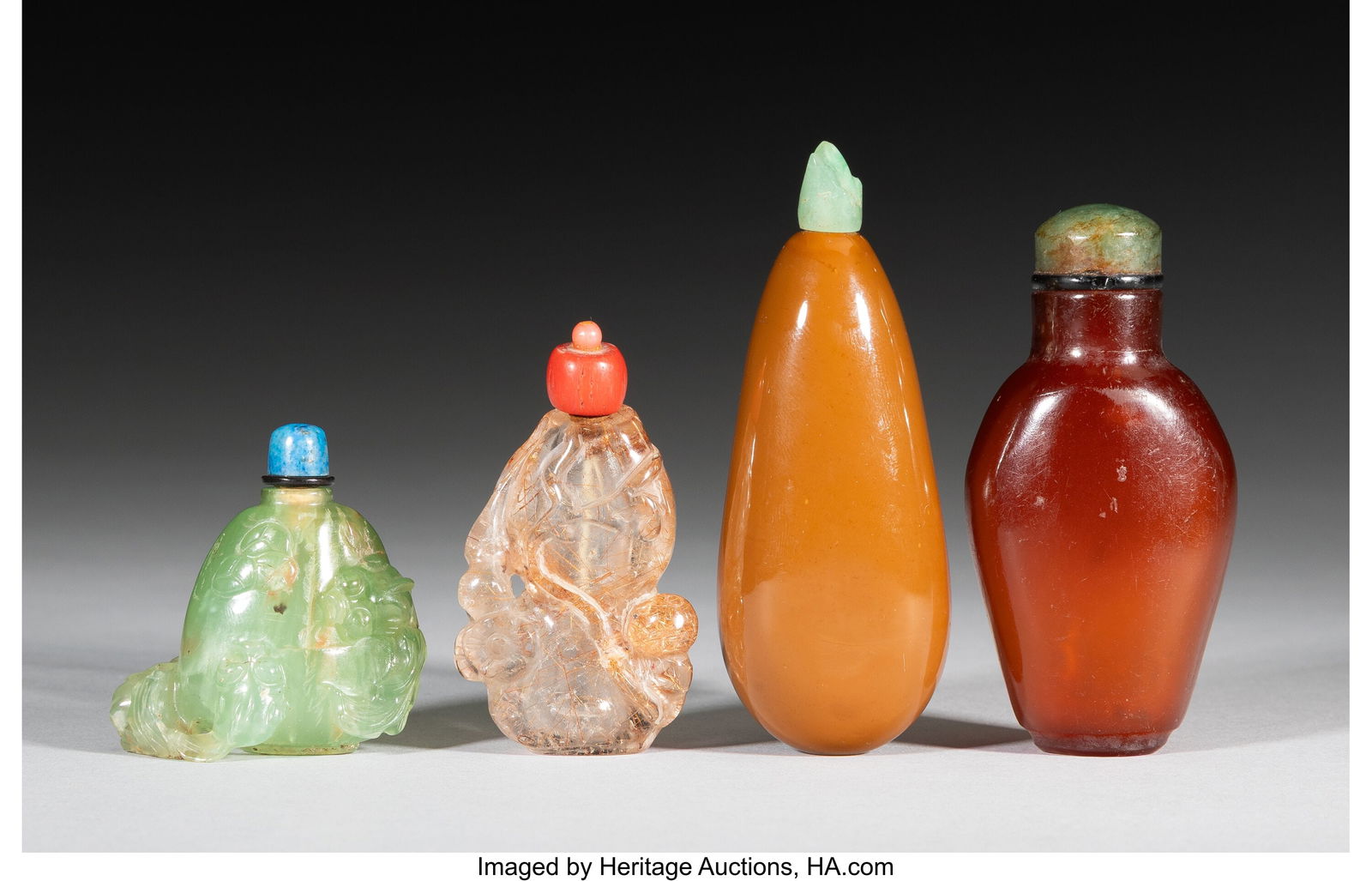 A Group of Four Stone and Amber Snuff Bottles 3- (1 of 2)