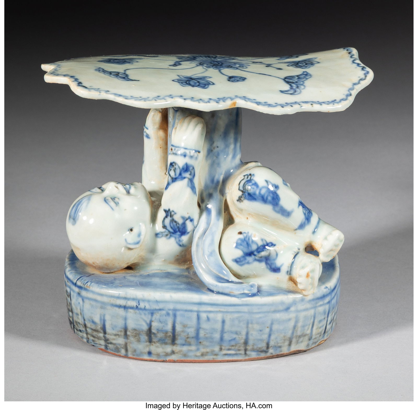 A Chinese Blue and White Neck Rest, 19th/20th ce: A Chinese Blue and White Neck Rest, 19th/20th century 5-5/8 x 6-1/2 x 4-1/2 inches (14.3 x 16.5 x 11.4 cm) Property from the collection of a