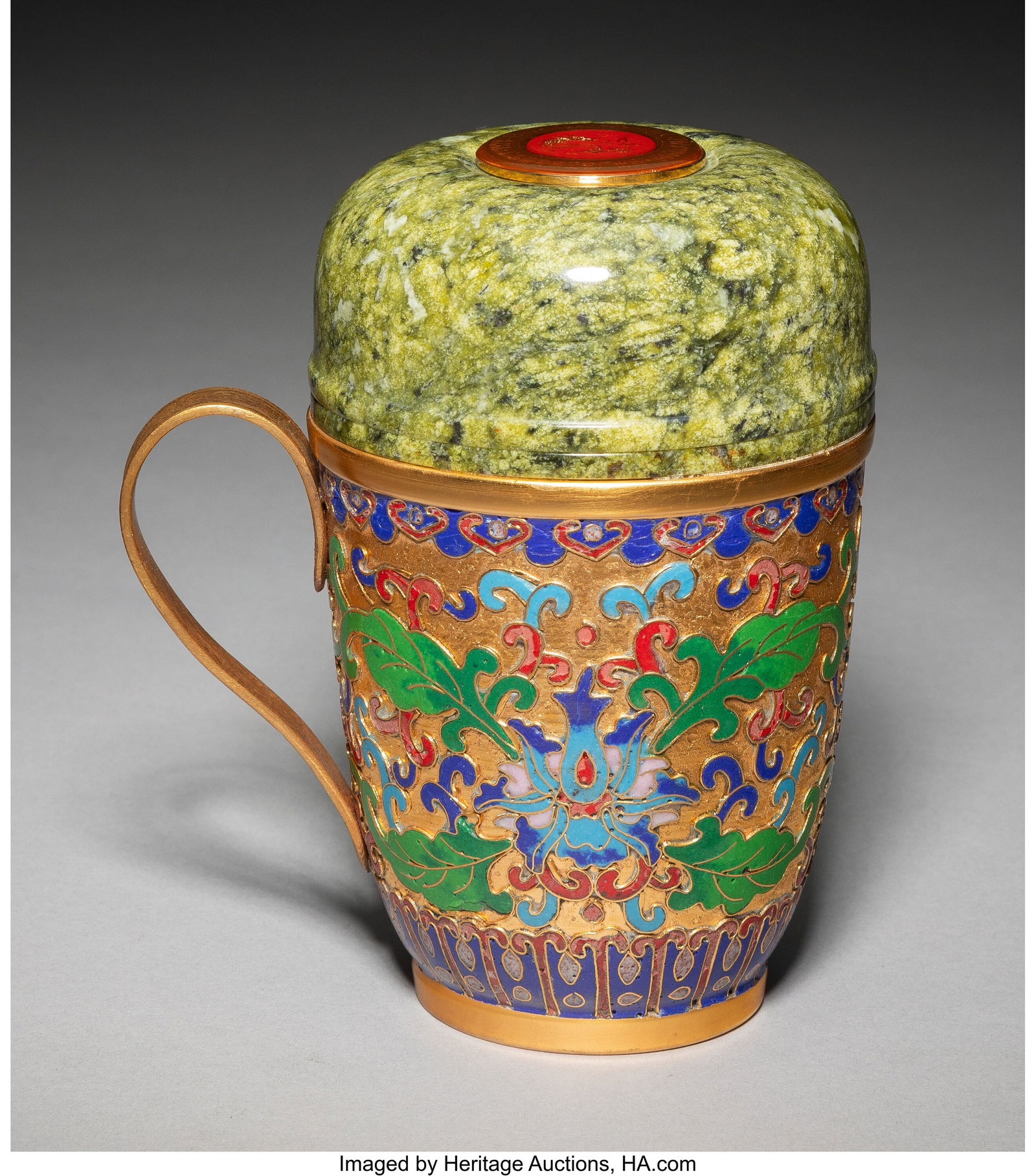 A Chinese Export Cloisonné Enameled Hardstone C: A Chinese Export Cloisonné Enameled Hardstone Covered Cup, 20th century 5-1/2 x 4-1/2 x 3-1/4 inches (14.0 x 11.4 x 8.3 cm) Property from