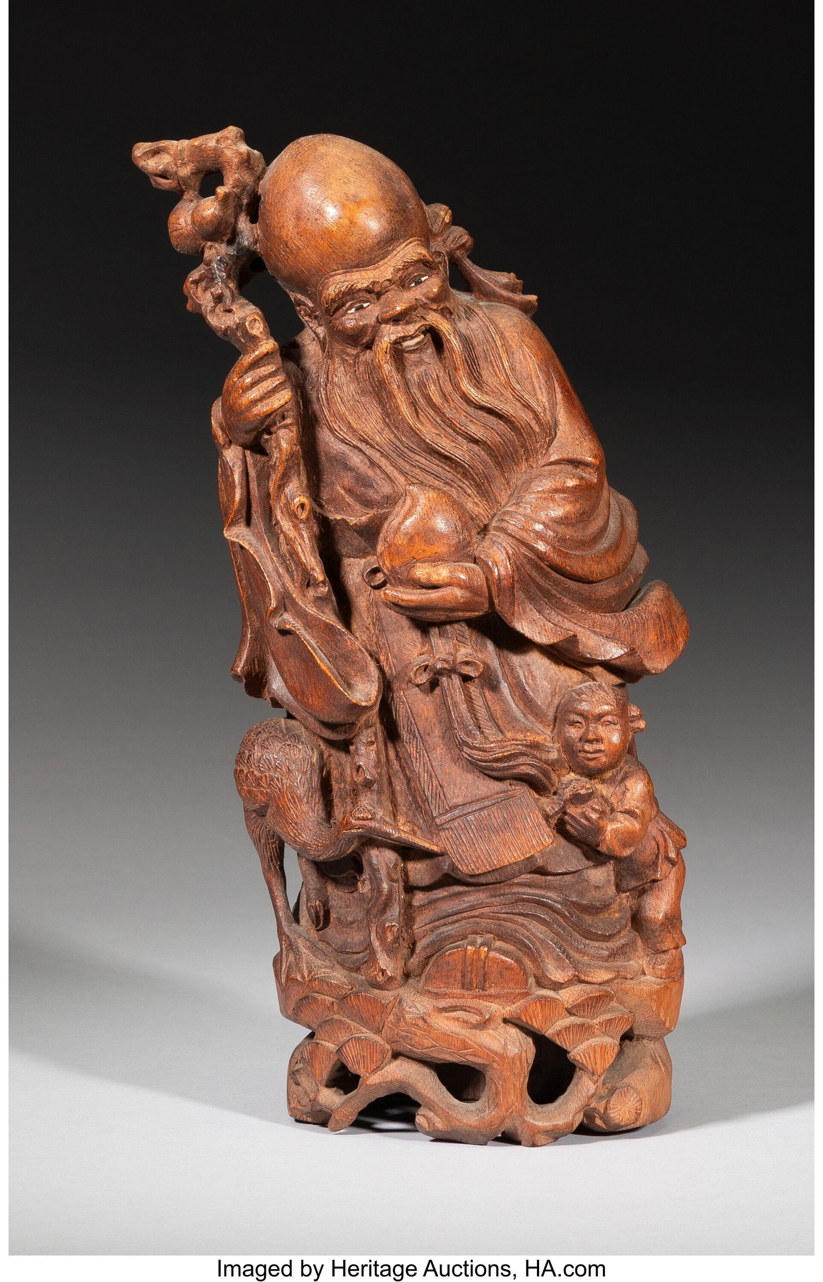 A Chinese Carved Bamboo Figure of Shoulao, 20th (1 of 2)