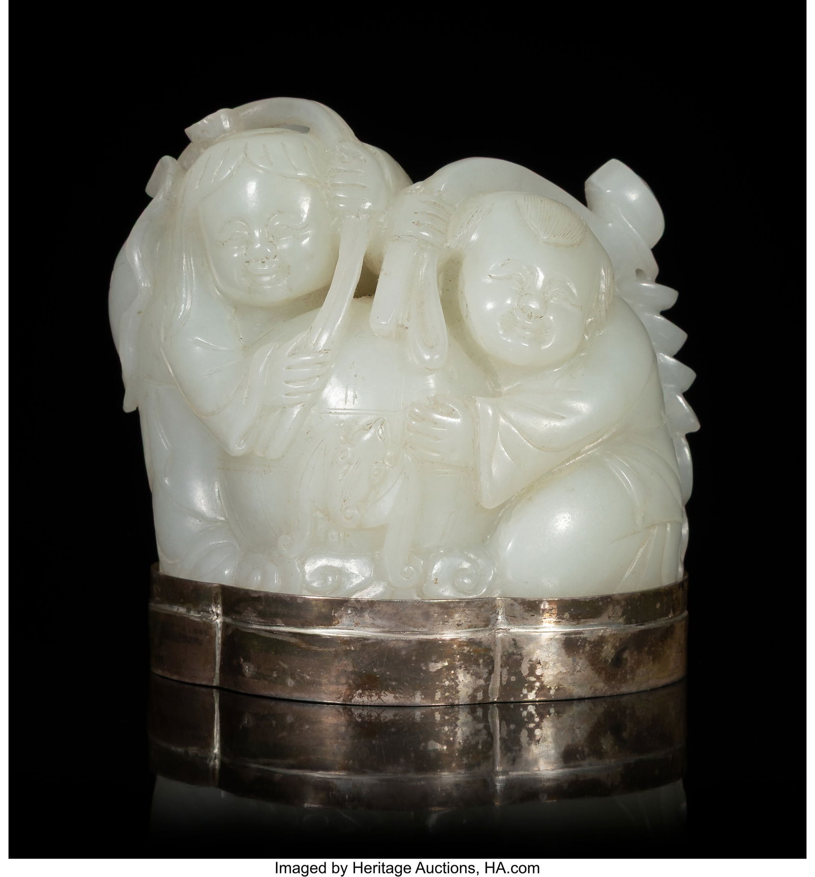 A Chinese Carved Celadon Jade Figure of Hehe Erx (1 of 2)