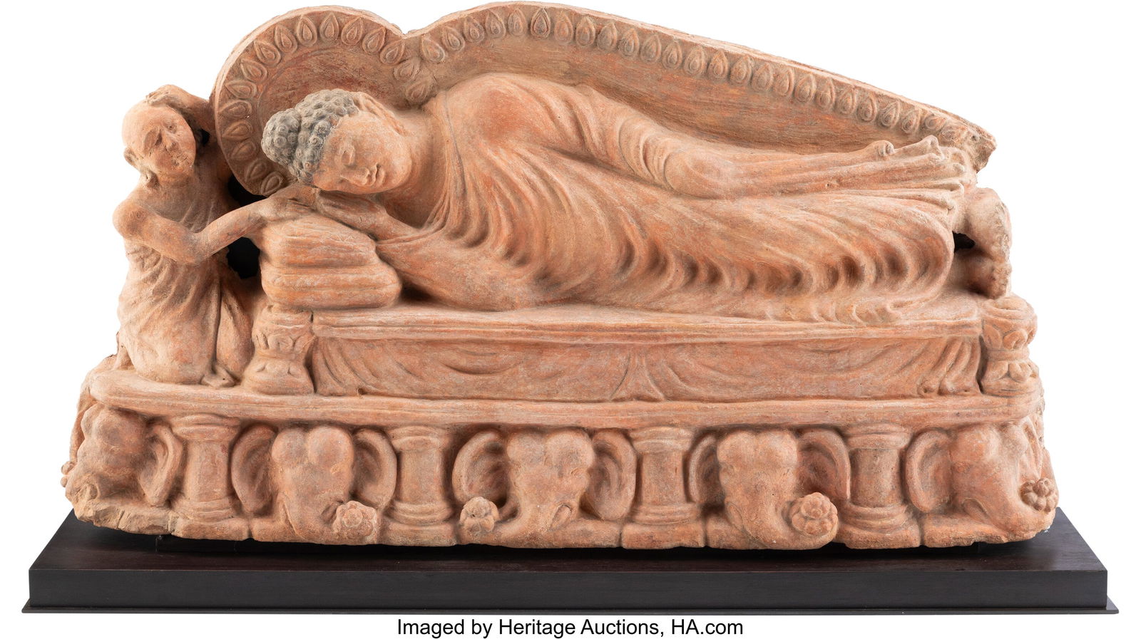 A Gandharan Terracotta and Wood-Mounted Figure o (1 of 4)