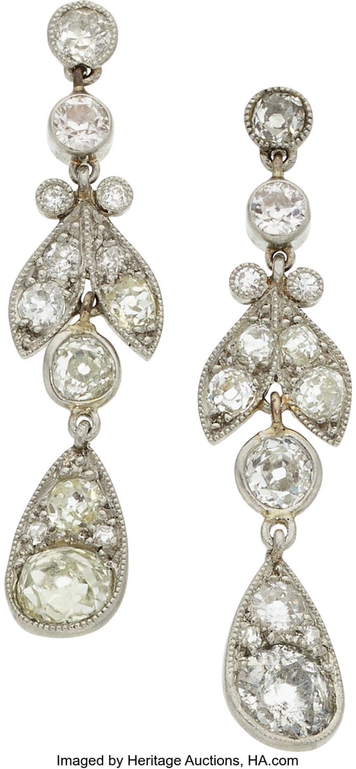 Diamond, Platinum, Gold Earrings Stones: Mine a: Diamond, Platinum, Gold Earrings Stones: Mine and European-cut diamonds weighing a total of approximately 2.35 carats Metal: Platinum and 10k gold Gross Weight: 4&