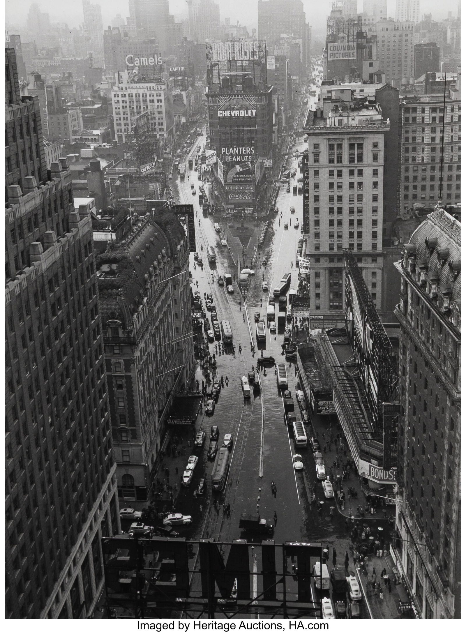 Lou Stoumen (American, 1917-1991) Times Square i: Lou Stoumen (American, 1917-1991) Times Square in the Rain, 1940 Gelatin silver print on Agfa paper, printed later 11-1/2 x 8-1/2 inches (29.2 x 21&peri