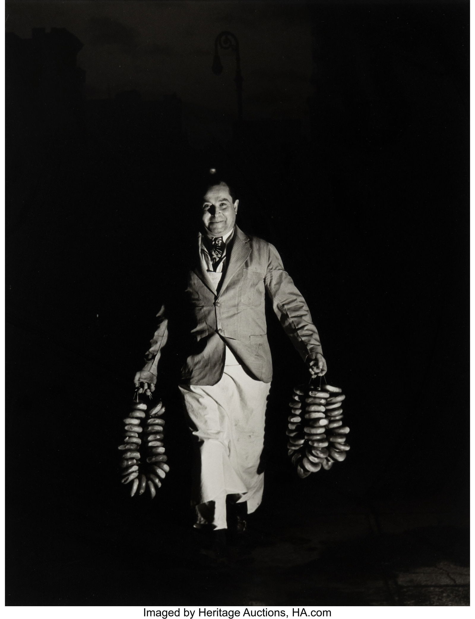 Weegee (American, 1899-1968) Max is Rushing in t: Weegee (American, 1899-1968) Max is Rushing in the Morning's Bagels to a Restaurant on Second Avenue for the Morning Trade, circa 1940 Gelatin silver print on Agfa paper, p