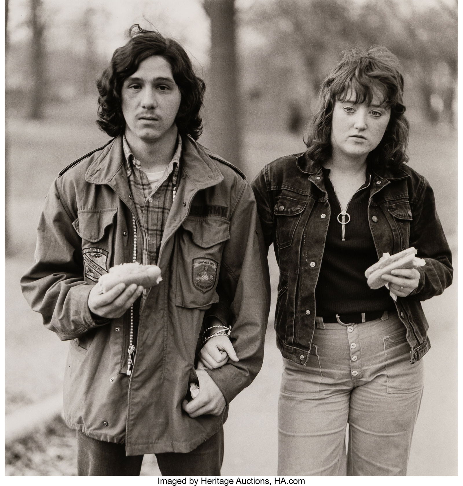Diane Arbus (American, 1923-1971) A Young Man an: Diane Arbus (American, 1923-1971) A Young Man and His Girlfriend with Hot Dogs in the Park, NYC, 1971 Gelatin silver print, printed later by Neil Selkirk 14-7/8 x