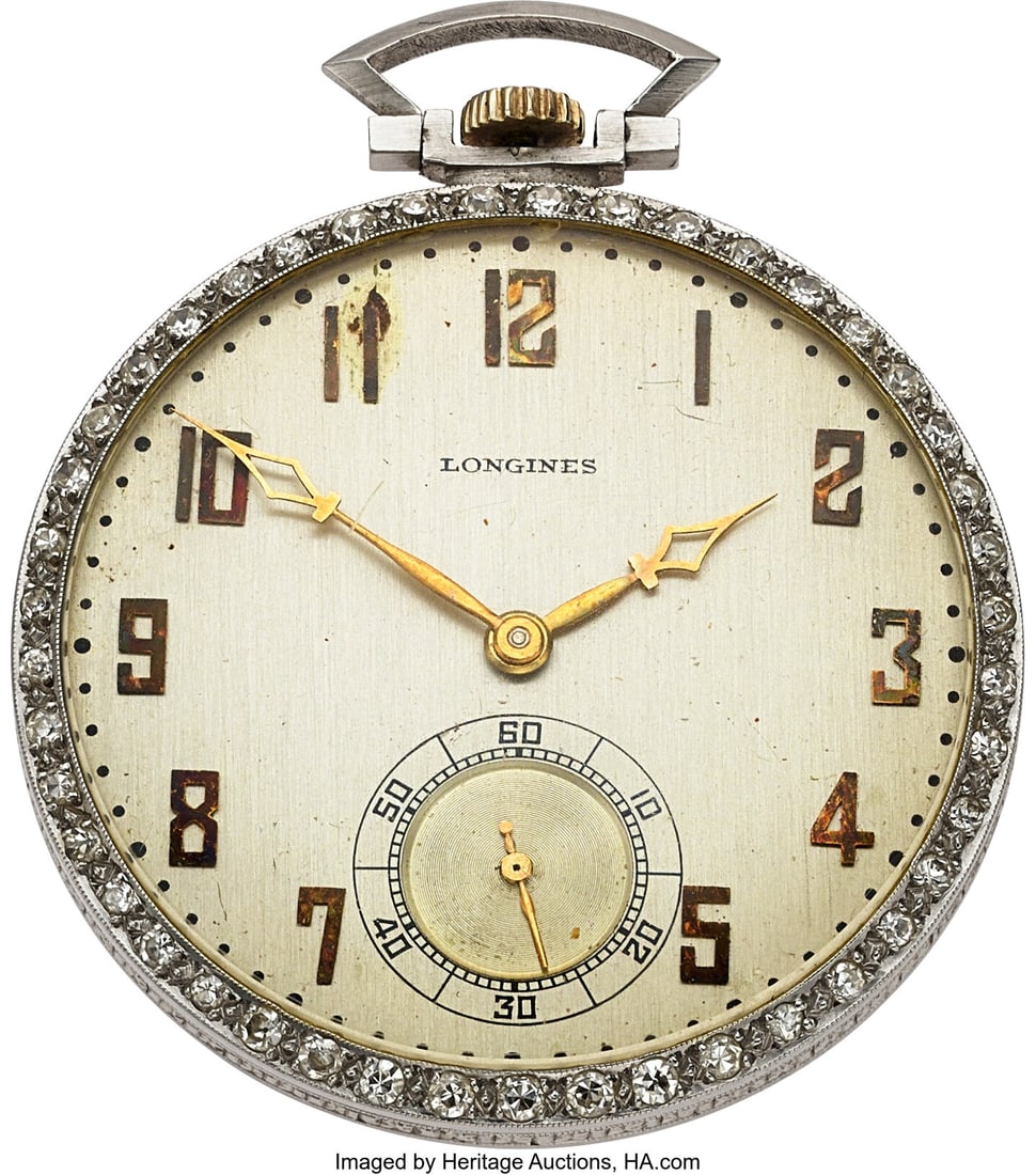 Longines Diamond Bezel Pocket watch from the Col: Longines Diamond Bezel Pocket watch from the Collection of Milton Berle Case: 41 mm, platinum, diamond set bezel, 32722 Dial: silver dial with gold applied Arabic numeral