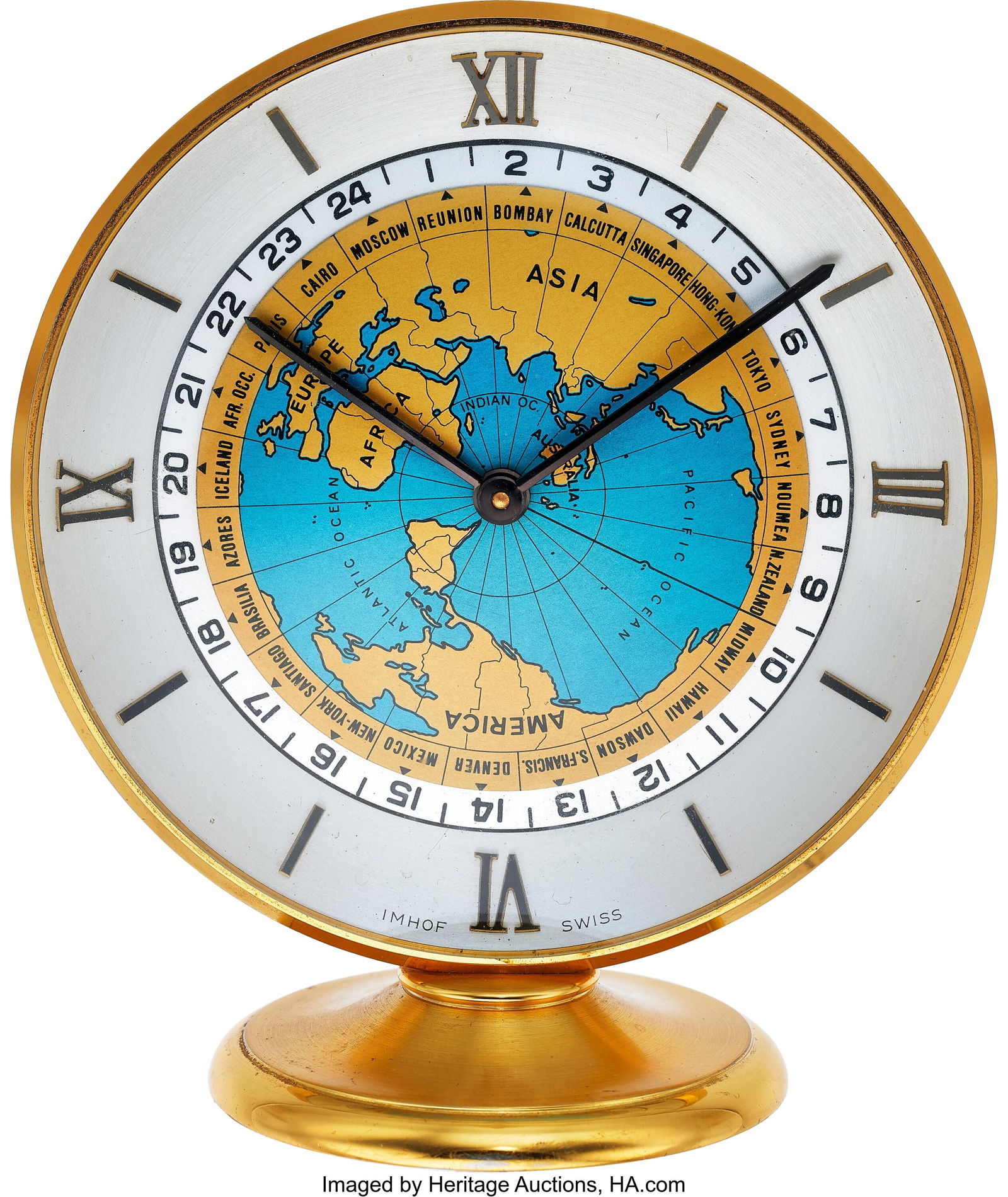 Imhof Style Clock Worldwide Quartz Table Clock: Imhof Style Clock Worldwide Quartz Table Clock Case: 11cm, polished brass Dial: silver gold roman dial with a captivating blue and gold mappa mundi, offering a unique view from