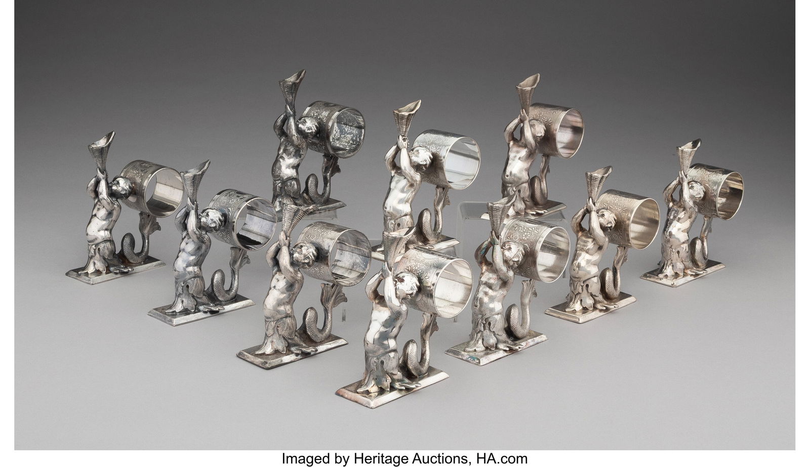 A Group of Ten American Silver-Plated Napkin Hol: A Group of Ten American Silver-Plated Napkin Holders, mid-19th century Marks: MERIDEN, B. COMPANY, QUADRUPLE PLATE, 201 5-1/8 x 2-1/8 x 4-3/8 inches &l