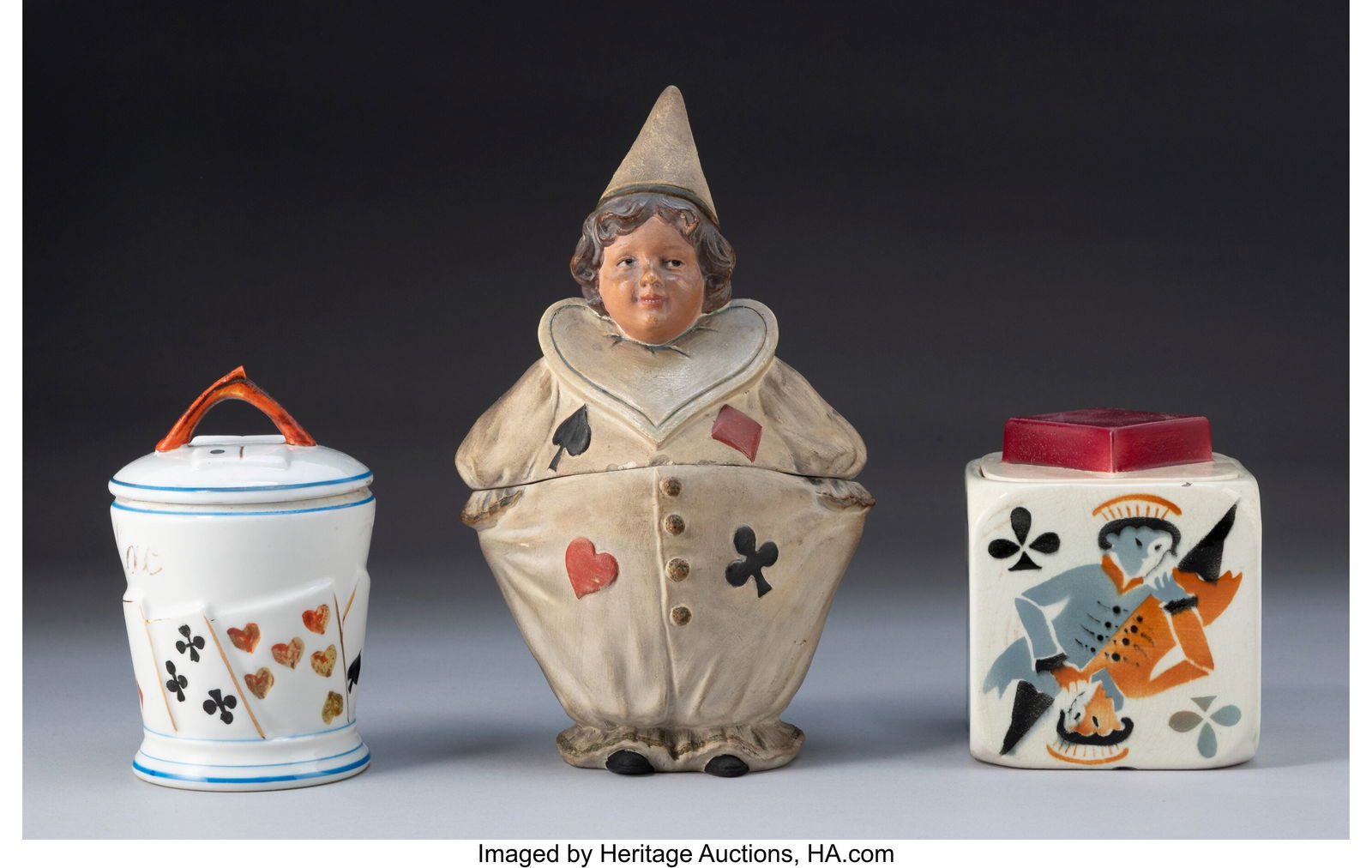 A Group of Three Ceramic Covered Boxes with Play: A Group of Three Ceramic Covered Boxes with Playing Card Motifs Marks: (various) 9-1/2 x 5-1/2 x 4-1/4 inches (24.1 x 14.0 x 10.8 cm) (t