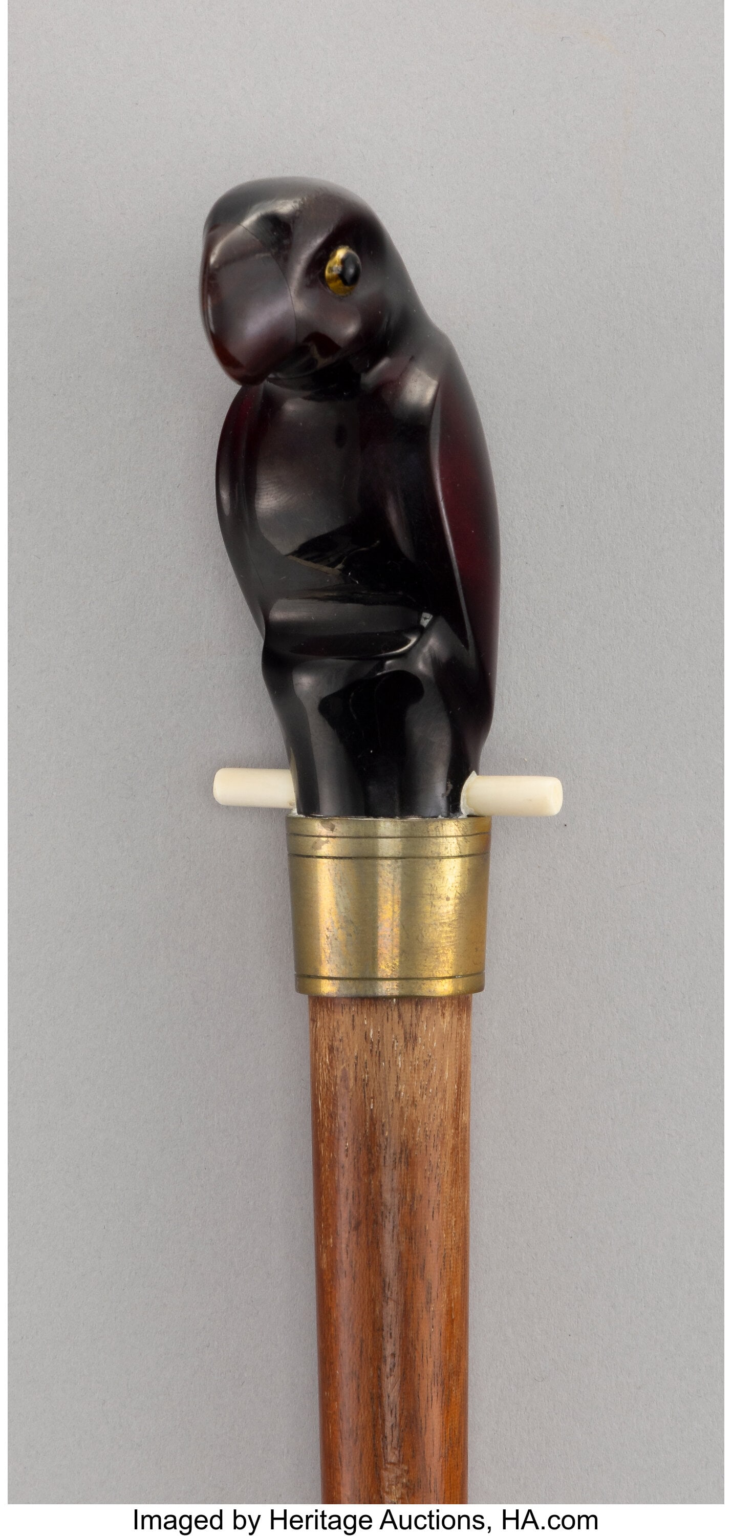 A Carved Polymer and Wood Cane: Parrot 36-1/4 x: A Carved Polymer and Wood Cane: Parrot 36-1/4 x 1-3/4 inches (92.1 x 4.4 cm) HID03101062020 © 2026 Heritage Auctions | All Rights Reserved www.HA