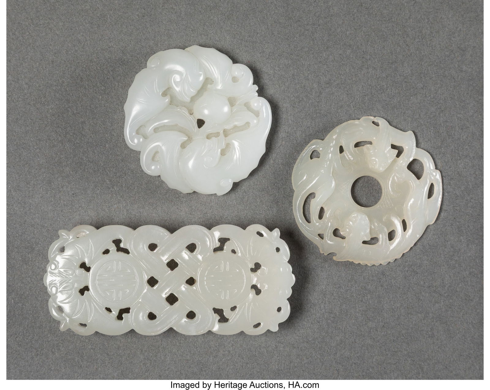 A Group of Three Chinese Jade Carvings 1-3/8 x 3: A Group of Three Chinese Jade Carvings 1-3/8 x 3-1/8 x 0-5/8 inches (3.5 x 7.9 x 1.6 cm) (largest) HID03101062020 © 2026 Heritage Auctions &ve