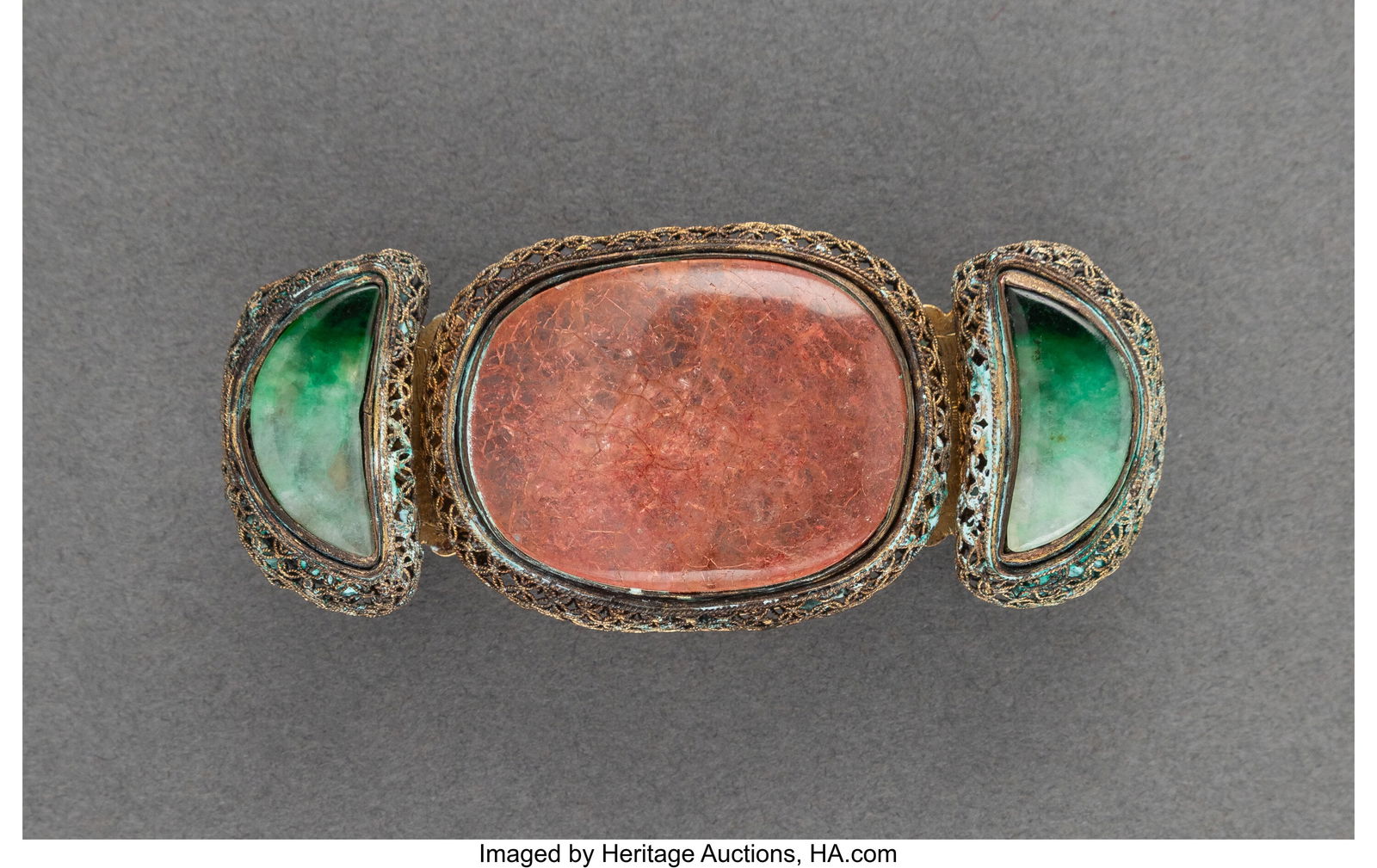 A Chinese Carved Tourmaline and Jadeite Gilt Met: A Chinese Carved Tourmaline and Jadeite Gilt Metal-Mounted Belt Buckle, 19th century 0-3/4 x 3-3/8 x 1-3/8 inches (1.9 x 8.6 x 3.5 cm) HID03101062020 &