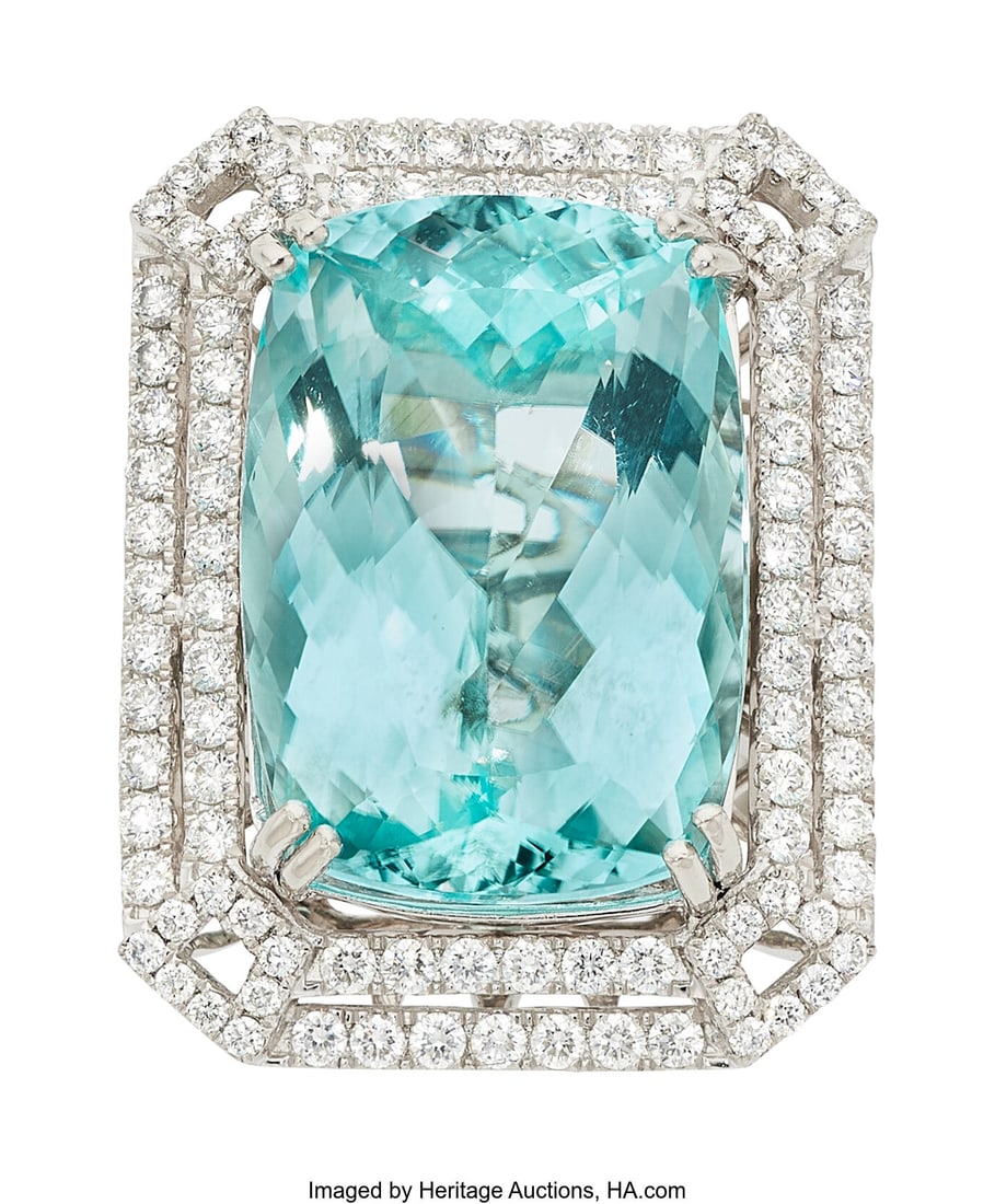 Paraiba-Type Tourmaline, Diamond, Platinum Ring: Paraiba-Type Tourmaline, Diamond, Platinum Ring Stones: Cushion-shaped Paraiba-type tourmaline weighing 28.17 carats; full-cut diamonds weighing a total of approximately