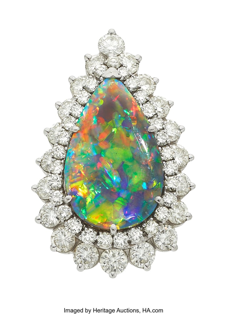 Black Opal, Diamond, Platinum Ring-Dant® Stone: Black Opal, Diamond, Platinum Ring-Dant® Stones: Black opal cabochon; full-cut diamonds weighing a total of approximately 3.15 carats Metal: Platinum Gross Weig
