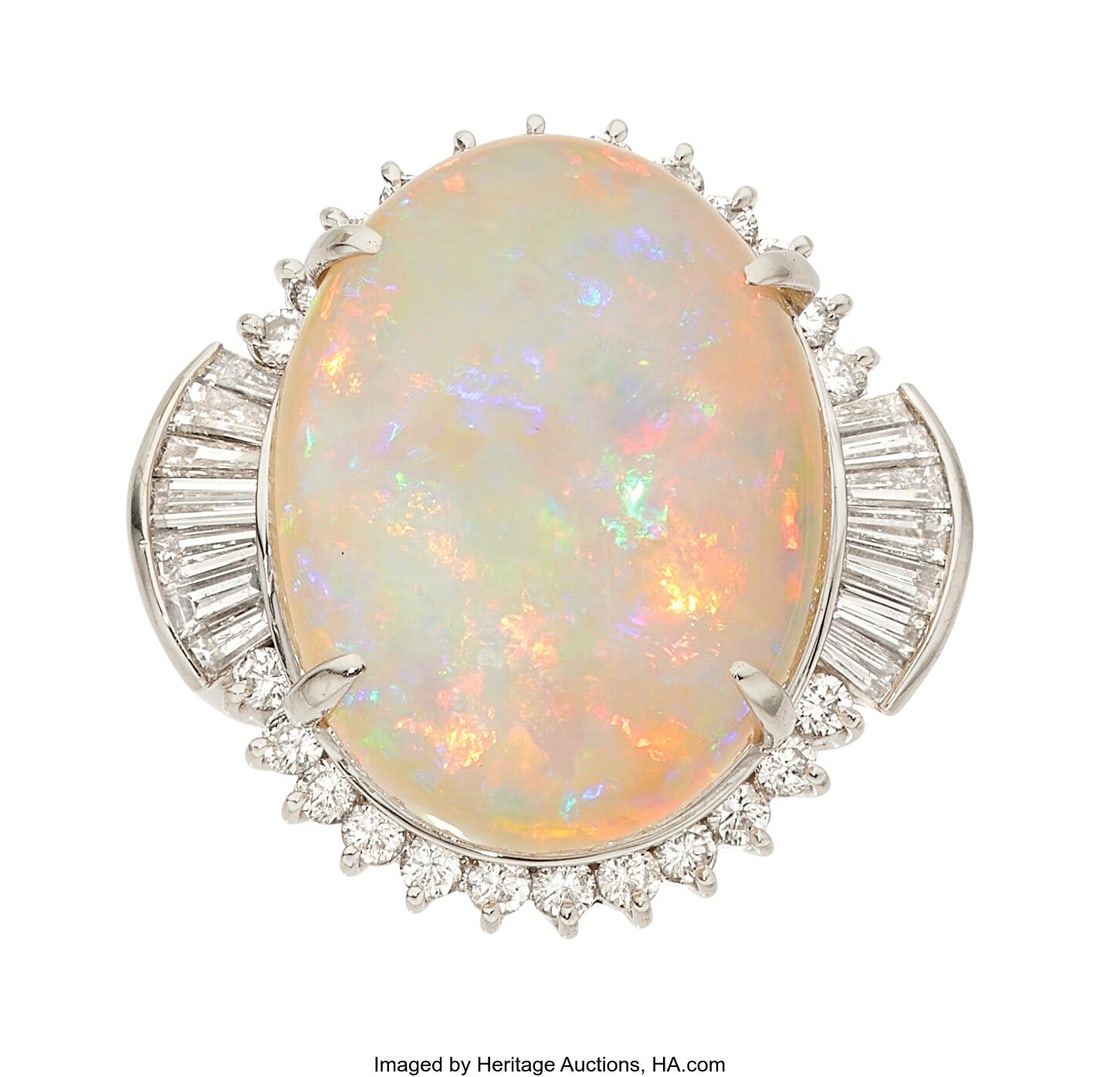Opal, Diamond, Platinum Ring Stones: Opal caboc: Opal, Diamond, Platinum Ring Stones: Opal cabochon; baguette and full-cut diamonds weighing a total of 1.72 carats Metal: Platinum Gross Weight: 17.80