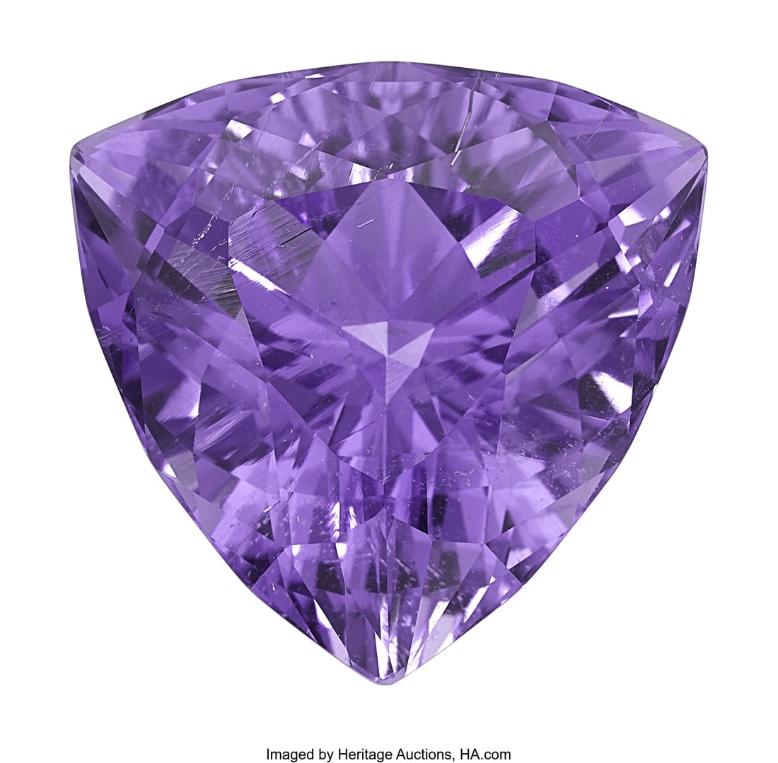 38.05 ct Tourmaline Shape: Triangular modified: 38.05 ct Tourmaline Shape: Triangular modified brilliant-cut Measurements: 22.60 x 22.55 x 14.12 mm Report: GIA # 1232732914 Property from a Colorado