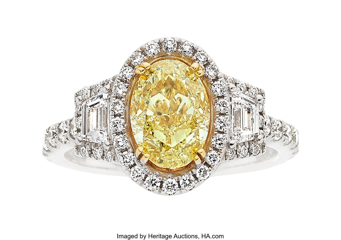 Ed. B Fancy Light Yellow Diamond, Diamond, Gold: Ed. B Fancy Light Yellow Diamond, Diamond, Gold Ring Stones: Oval-shaped colored diamond weighing 1.71 carats; trapezoid and full-cut diamonds weighing a total of