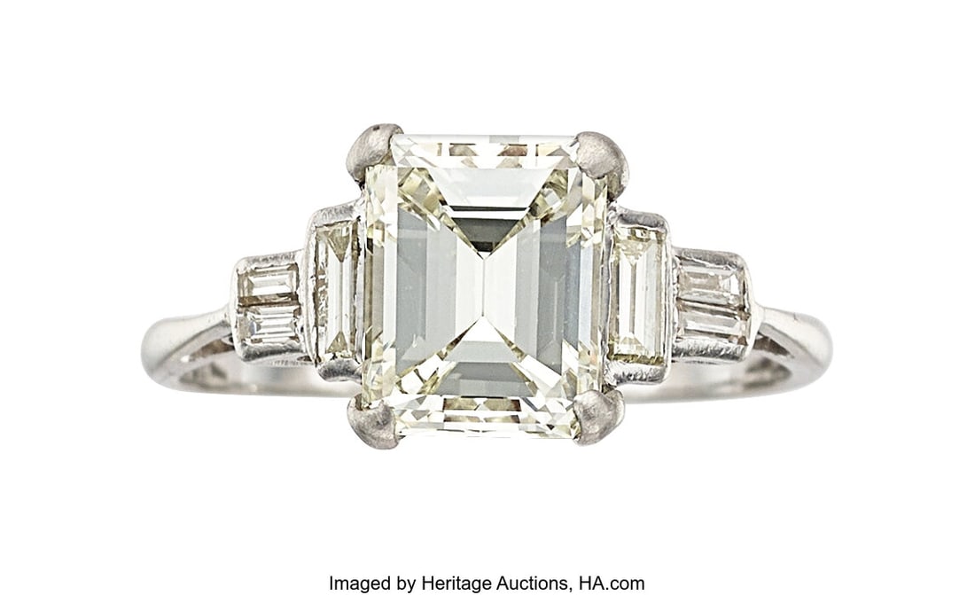 Diamond, Platinum Ring Stones: Emerald-cut diam: Diamond, Platinum Ring Stones: Emerald-cut diamond weighing 2.66 carats; baguette-cut diamonds weighing a total of approximately 0.45 carat Metal: Platinum Gross W