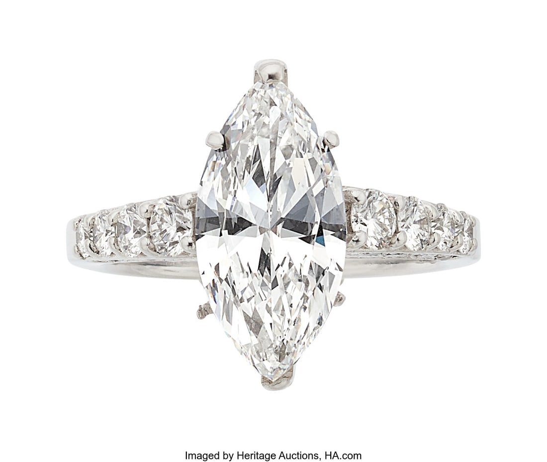 Diamond, Platinum Ring Stones: Marquise-shaped: Diamond, Platinum Ring Stones: Marquise-shaped diamond weighing 3.01 carats; full-cut diamonds weighing a total of approximately 0.75 carat Metal: Platinum Gross W