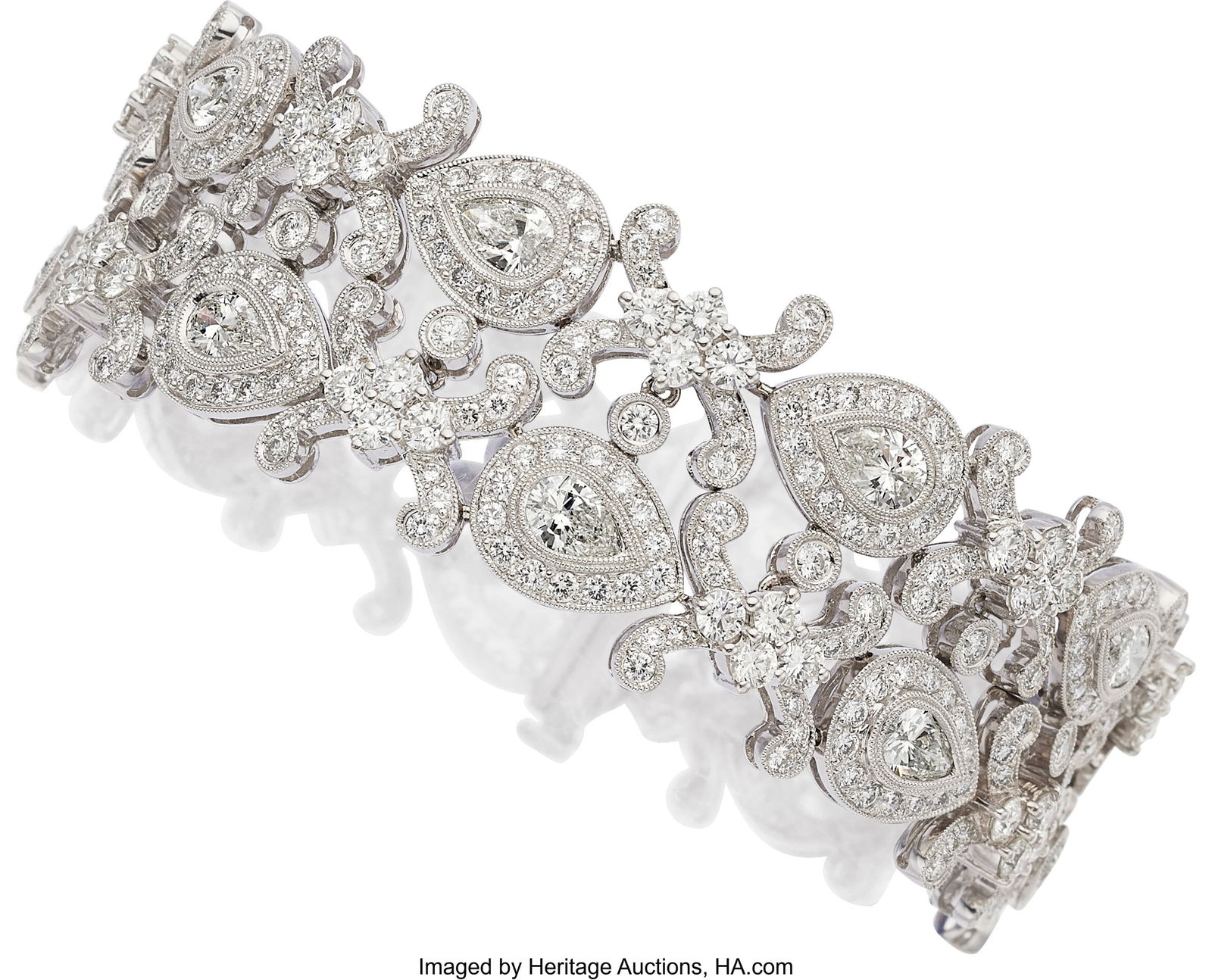 Diamond, White Gold Bracelet Stones: Pear-shape: Diamond, White Gold Bracelet Stones: Pear-shaped diamonds weighing a total of approximately 6.50 carats; full-cut diamonds weighing a total of approximately 12.00