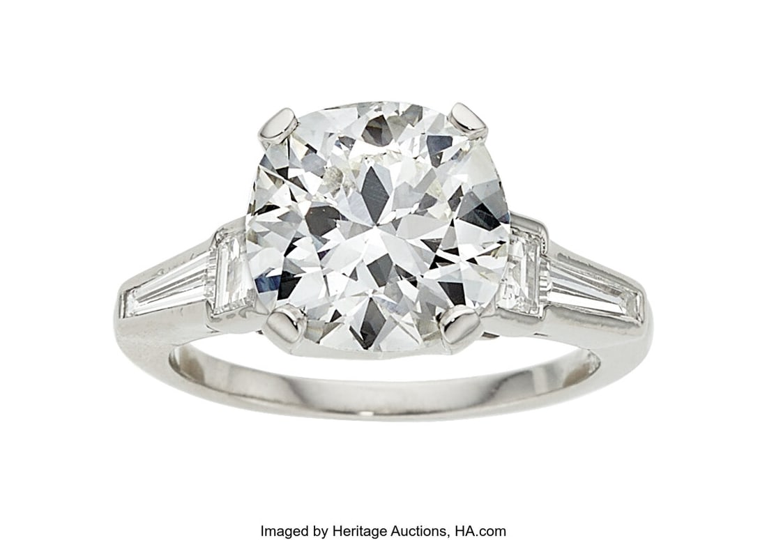 Diamond, Platinum Ring Stones: Round brilliant-: Diamond, Platinum Ring Stones: Round brilliant-cut diamond weighing 3.59 carats; baguette-cut diamonds weighing a total of approximately 0.75 carat Metal: