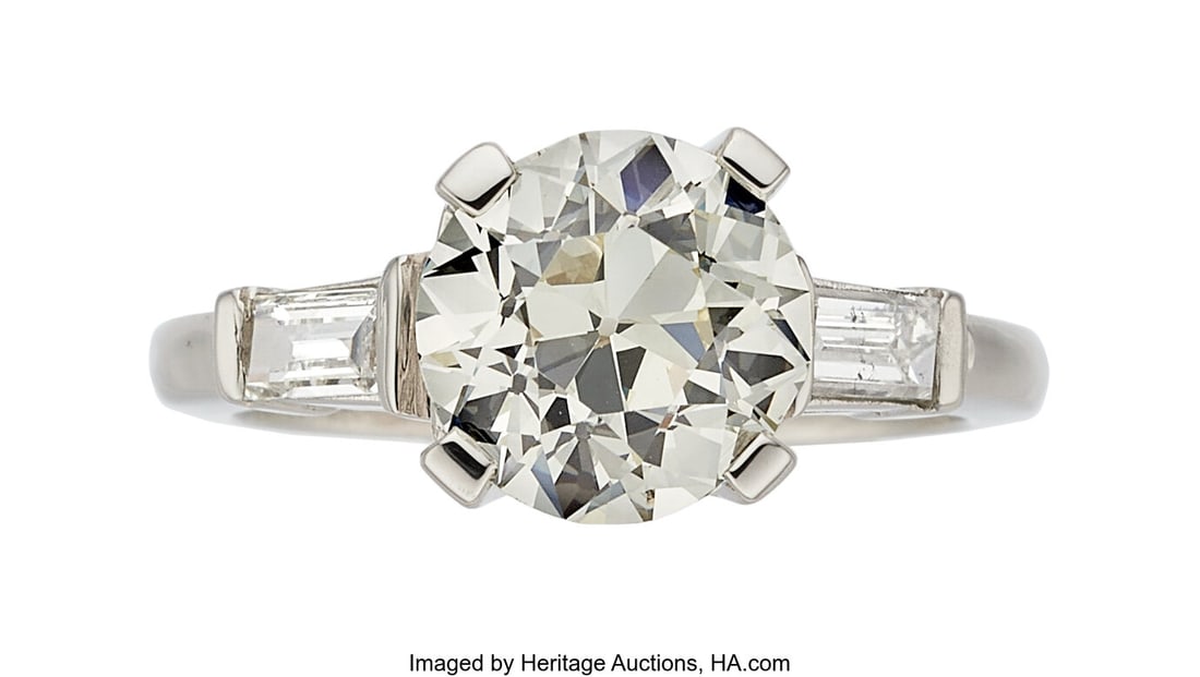 Diamond, Platinum Ring Stones: European-cut dia: Diamond, Platinum Ring Stones: European-cut diamond weighing 2.33 carats; baguette-cut diamonds weighing a total of approximately 0.35 carat Metal: Platinum Gross