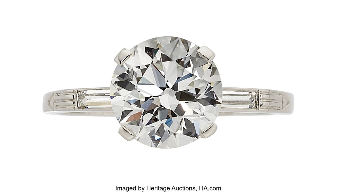 J.E. Caldwell & Co. Art Deco Diamond, Platinum: J.E. Caldwell & Co. Art Deco Diamond, Platinum Ring, circa 1926 Stones: Round brilliant-cut diamond weighing 2.13 carats; baguette-cut