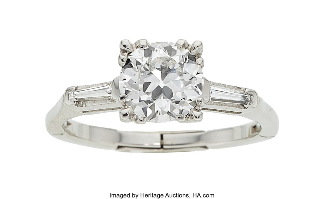 Diamond, Platinum Ring Stones: Circular brillia: Diamond, Platinum Ring Stones: Circular brilliant-cut diamond weighing 2.01 carats; tapered baguette-cut diamonds weighing a total of approximately 0.10 carat Metal&colo