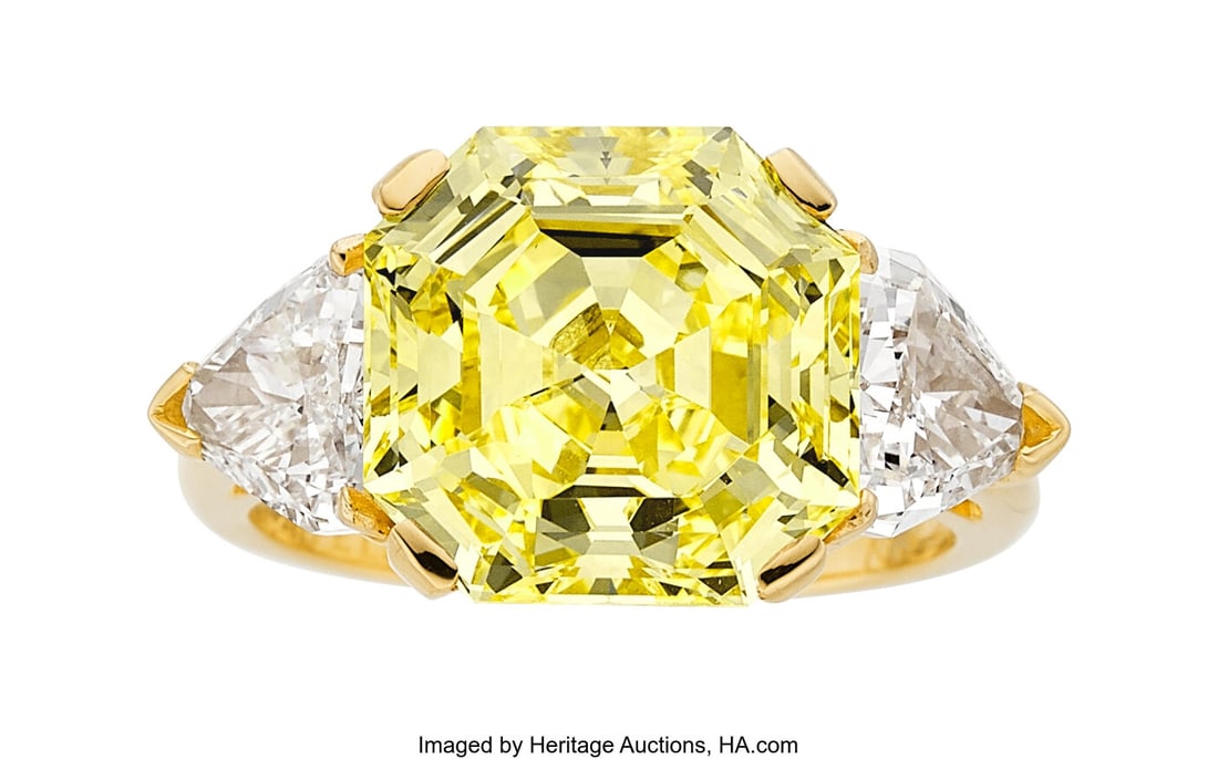 Van Cleef & Arpels Fancy Intense Yellow Diamond,: Van Cleef & Arpels Fancy Intense Yellow Diamond, Diamond, Gold Ring Stones: Cut-cornered square step-cut fancy intense yellow diamond weighing 6.88 carats; calf's-hea