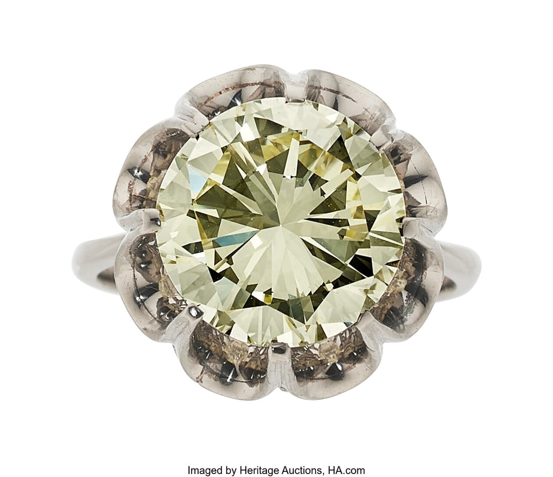 Diamond, White Gold Ring Stones: Round brillian: Diamond, White Gold Ring Stones: Round brilliant-cut diamond weighing 6.45 carats Metal: 14k white gold Gross Weight: 8.50 grams Size: 8 (sizeable&rpar