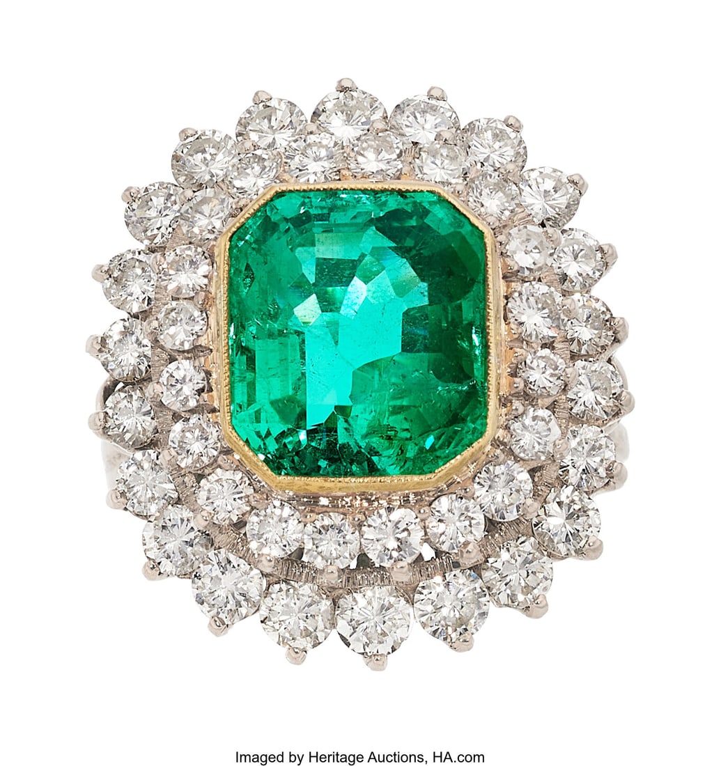 Colombian Emerald, Diamond, Gold, White Metal Ri: Colombian Emerald, Diamond, Gold, White Metal Ring Stones: Octagonal-shaped emerald weighing approximately 6.00 carats; full-cut diamonds weighing a total of approx