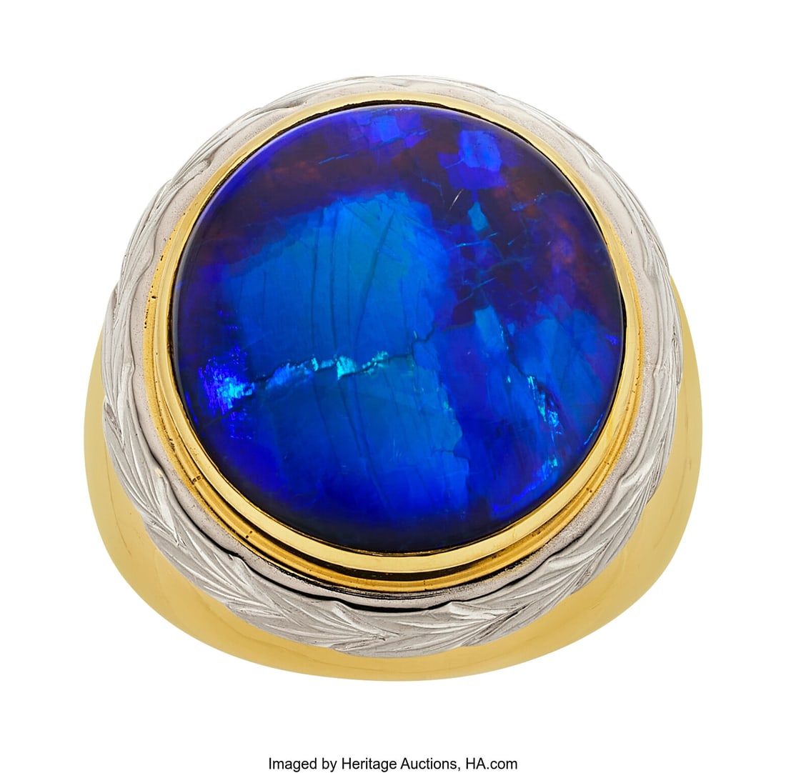 Sarosi Black Opal, Gold Ring Stones: Black opal: Sarosi Black Opal, Gold Ring Stones: Black opal cabochon Metal: 18k white and yellow gold Marked: Sarosi Gross Weight: 29.50 grams Size: 8 (sizeable&rpa