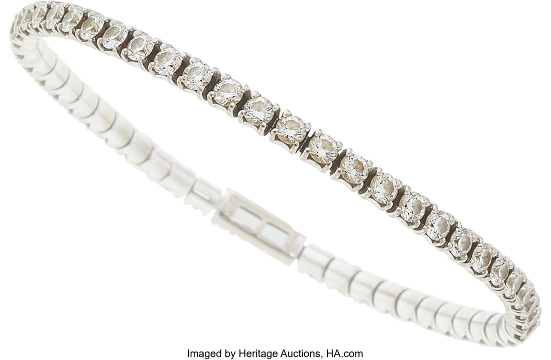 Cartier Diamond, White Gold Bracelet Stones: Fu: Cartier Diamond, White Gold Bracelet Stones: Full-cut diamonds weighing a total of approximately 5.00 carats Metal: 18k gold Marked: Cartier Collection: Lignes Ess
