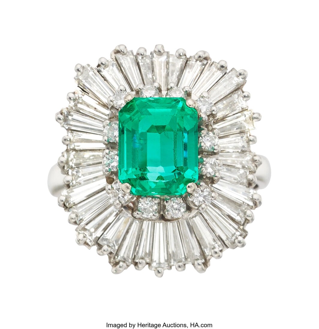 Emerald, Diamond, Platinum Ring Stones: Octagon: Emerald, Diamond, Platinum Ring Stones: Octagonal-shaped emerald weighing approximately 2.75 carats; baguette-cut diamonds weighing a total of approximately 3.00 c