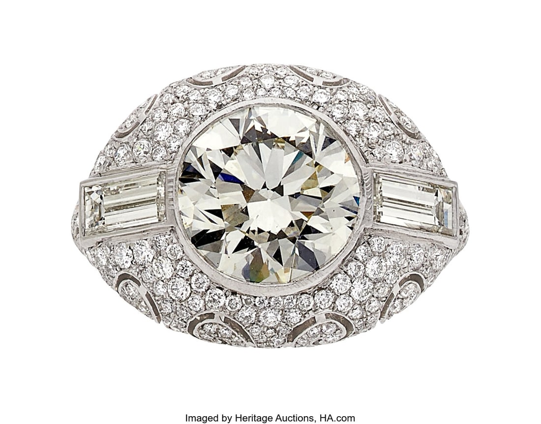 Diamond, Platinum, Palladium, Silver Ring Stone: Diamond, Platinum, Palladium, Silver Ring Stones: Round brilliant-cut diamond weighing approximately 4.00 carats; full-cut diamonds weighing a total of approximatel