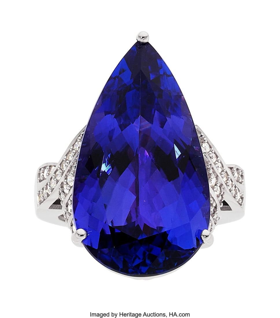 Tanzanite, Diamond, White Gold Ring Stones: Pea: Tanzanite, Diamond, White Gold Ring Stones: Pear-shaped tanzanite weighing 26.44 carats; full-cut diamonds weighing a total of 0.34 carat Metal: 18k white go