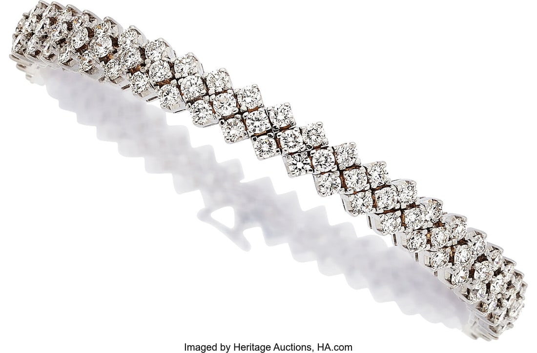 Diamond, White Gold Bracelet Stones: Full-cut d: Diamond, White Gold Bracelet Stones: Full-cut diamonds weighing a total of approximately 5.25 carats Metal: 18k white gold Gross Weight: 24.80 grams Dimensions&co