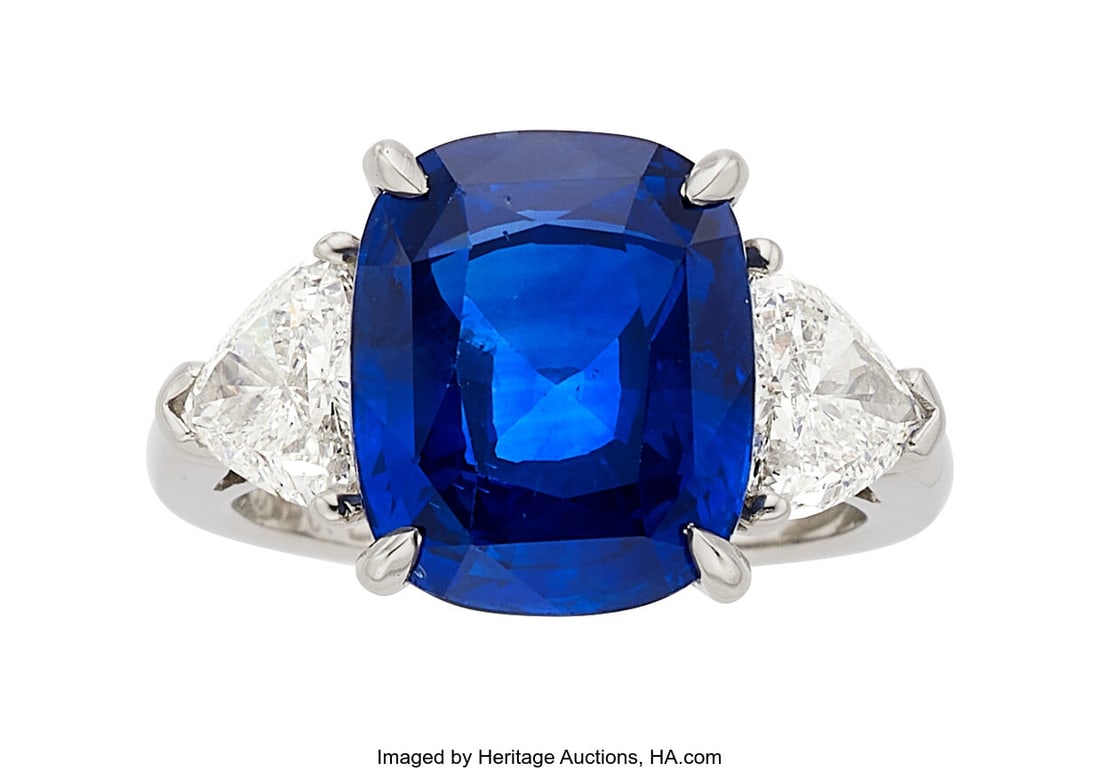 Ceylon Sapphire, Diamond, Platinum Ring Stones: Ceylon Sapphire, Diamond, Platinum Ring Stones: Cushion-shaped sapphire weighing approximately 5.90 carats; triangular-shaped diamonds weighing a total of approximately 1