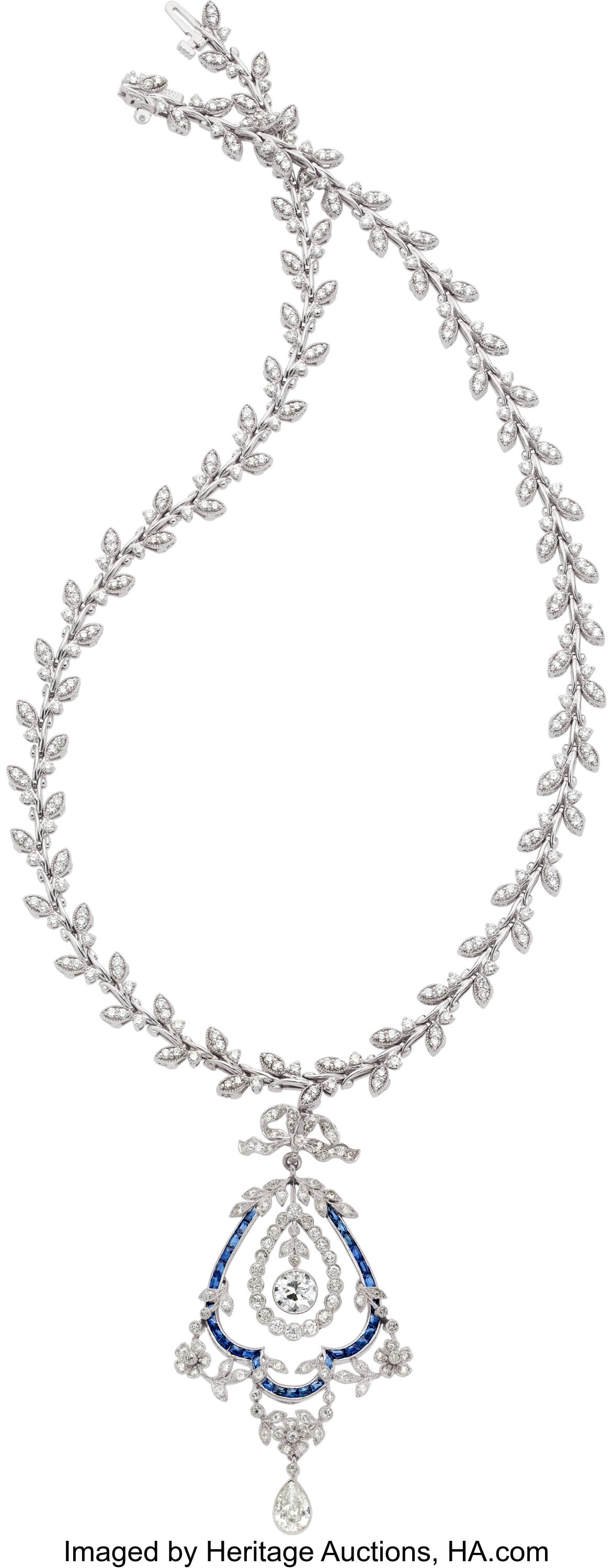 Diamond, Sapphire, Platinum, White Gold Pendant: Diamond, Sapphire, Platinum, White Gold Pendant-Necklace Stones: Transitional-cut diamond weighing approximately 0.95 carat; pear-shaped diamond weighing approximat