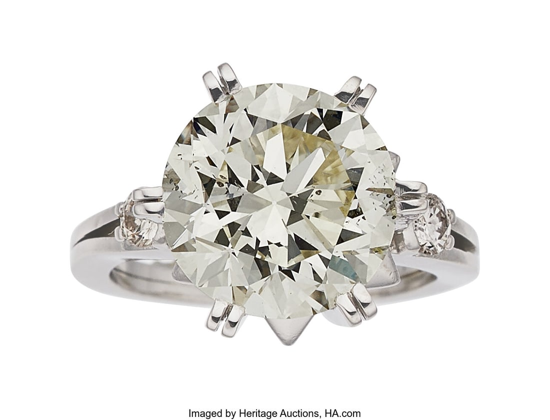 Art Deco Diamond, Platinum Ring Stones: Round b: Art Deco Diamond, Platinum Ring Stones: Round brilliant-cut diamond weighing 5.96 carats; full-cut diamonds weighing a total of approximately 0.20 carat Metal: Pla
