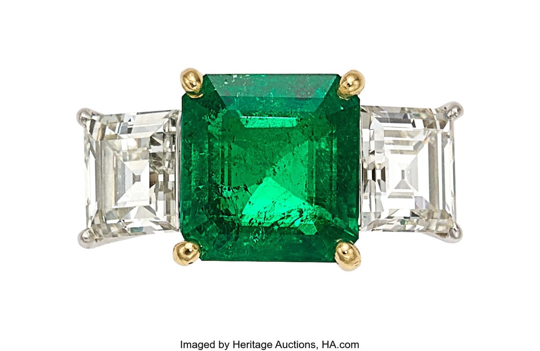Colombian Emerald, Diamond, Platinum, Gold Ring: Colombian Emerald, Diamond, Platinum, Gold Ring Stones: Octagonal-shaped emerald weighing 4.19 carats; rectangular-shaped diamonds weighing a total of 2.97 c