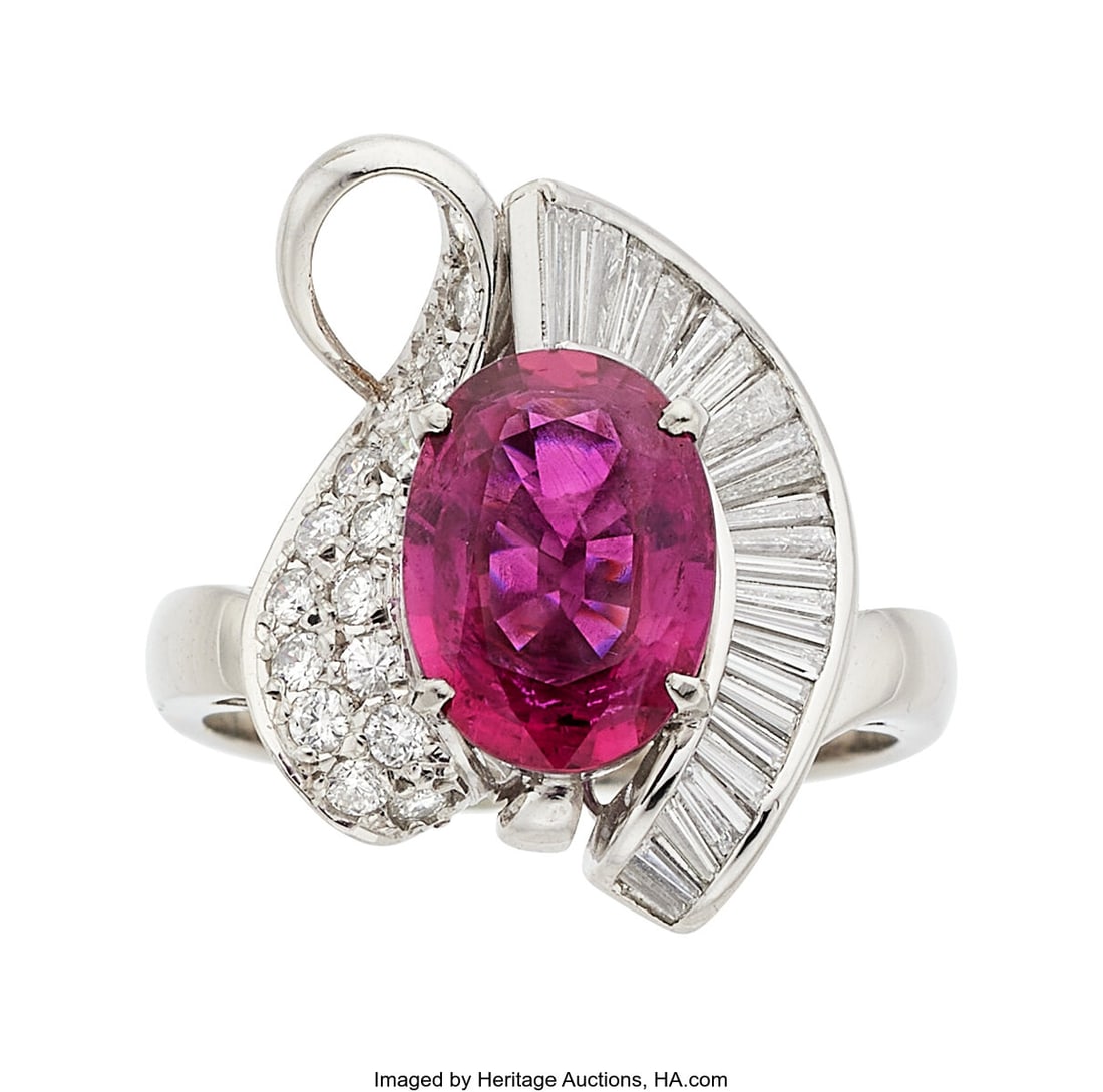 Ruby, Diamond, Platinum Ring Stones: Oval-shape: Ruby, Diamond, Platinum Ring Stones: Oval-shaped ruby weighing 2.99 carats; baguette and full-cut diamonds weighing a total of 0.74 carat Metal: Platinum Gro