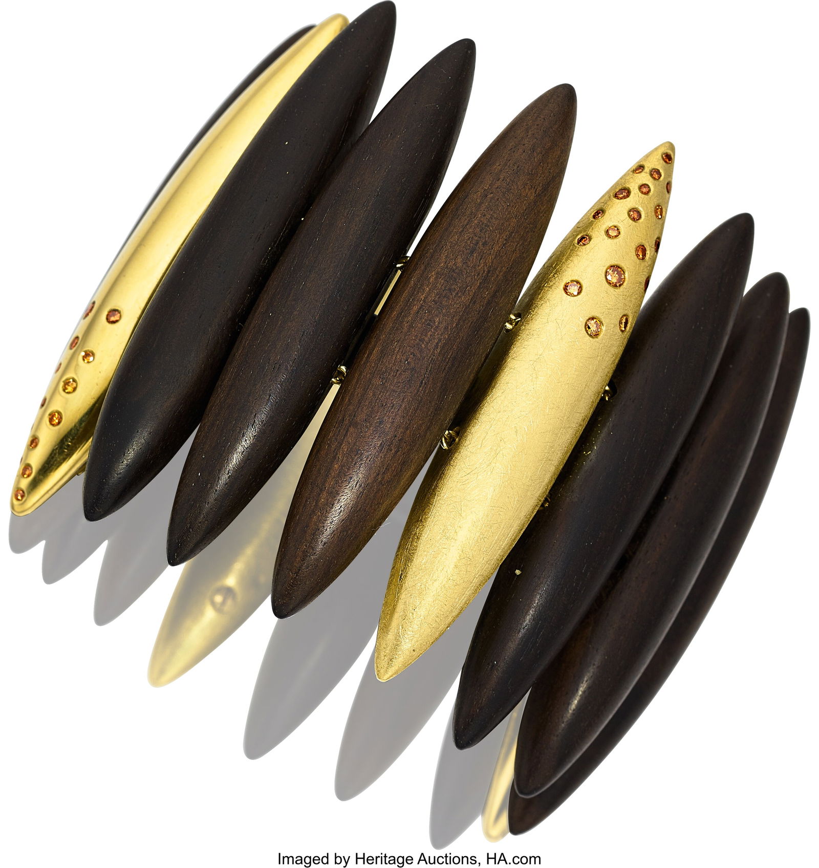 Karin Tremonti Colored Diamond, Wood, Gold Brace: Karin Tremonti Colored Diamond, Wood, Gold Bracelet Stones: Full-cut colored diamonds weighing a total of approximately 2.00 carats Element: Wood Metal: 18k gold G