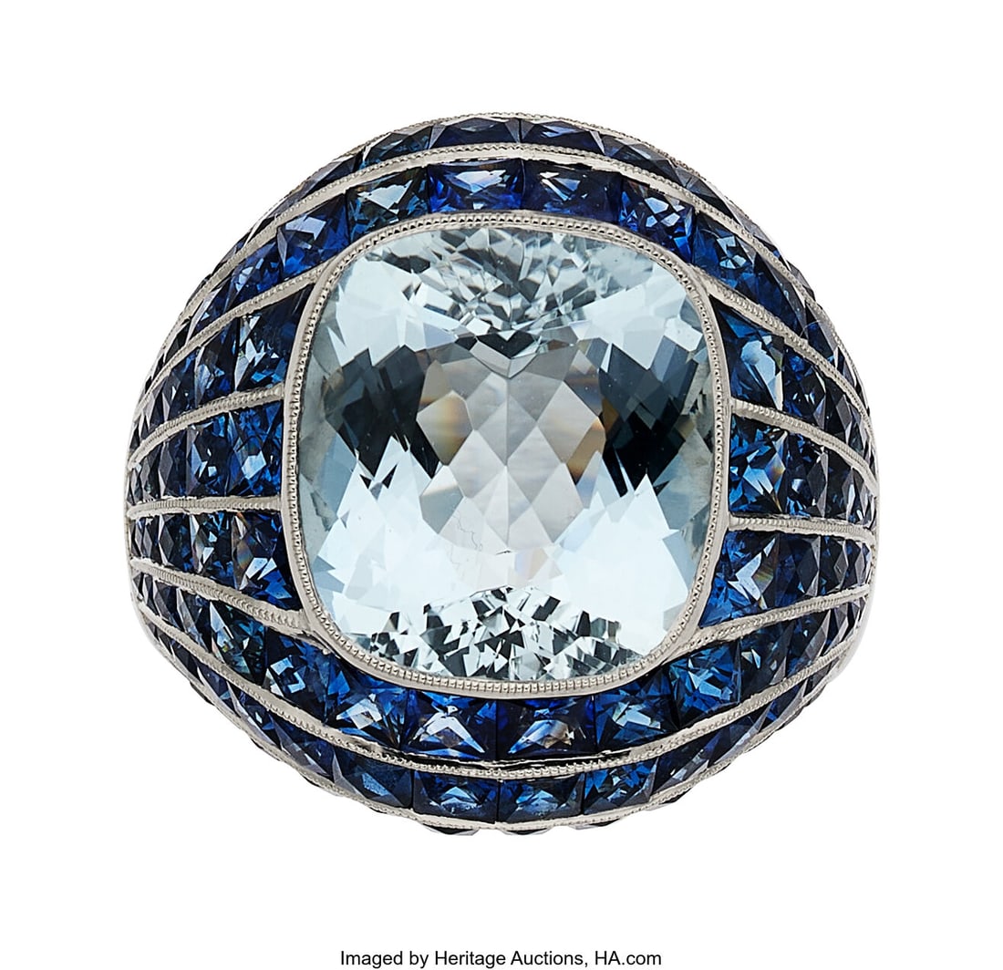 Sabrina Aquamarine, Sapphire, Platinum Ring Sto: Sabrina Aquamarine, Sapphire, Platinum Ring Stones: Cushion-shaped aquamarine weighing 5.48 carats; French and calibré-cut sapphires Metal: Platinum Marked&c