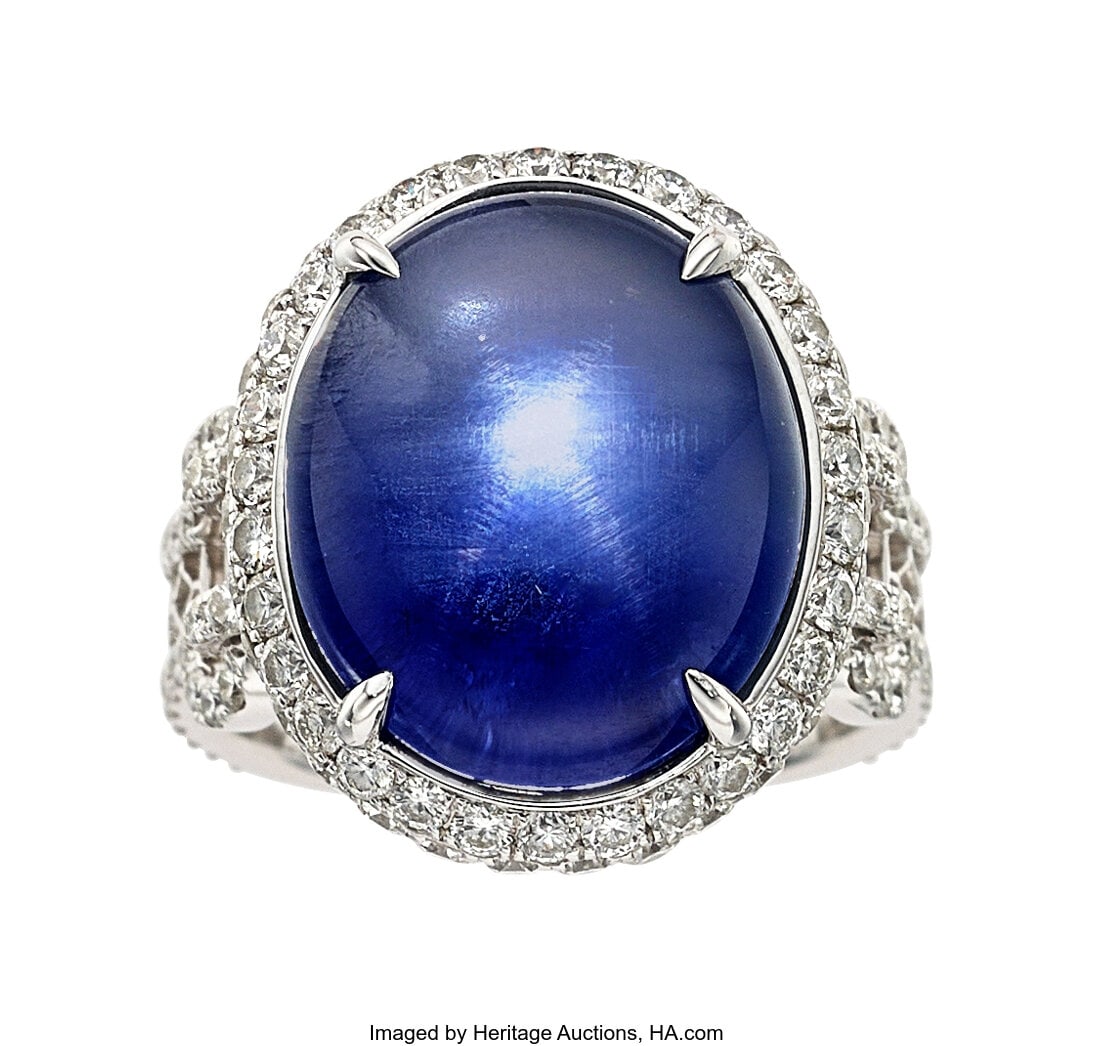 Burma Star Sapphire, Diamond, White Gold Ring S: Burma Star Sapphire, Diamond, White Gold Ring Stones: Star sapphire cabochon; full-cut diamonds weighing a total of 1.93 carats Metal: 18k white gold Gross Weight&c