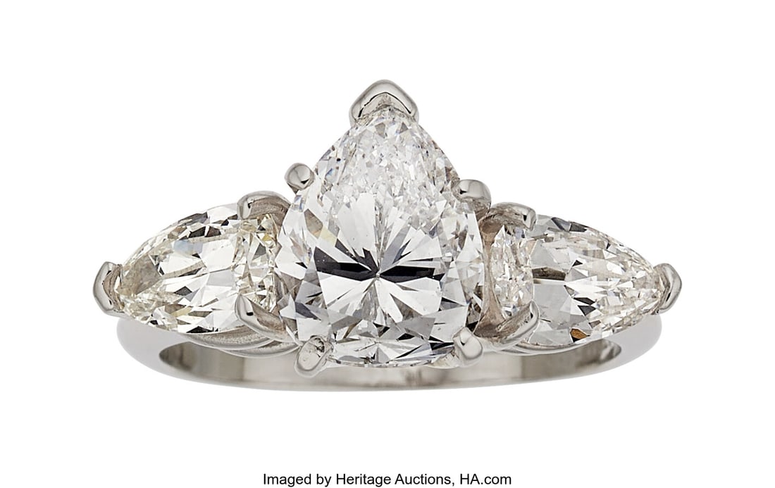 Diamond, Platinum Ring Stones: Pear-shaped diam: Diamond, Platinum Ring Stones: Pear-shaped diamond weighing 2.73 carats; pear-shaped diamonds weighing a total of approximately 1.30 carats Metal: Platinum Gross W