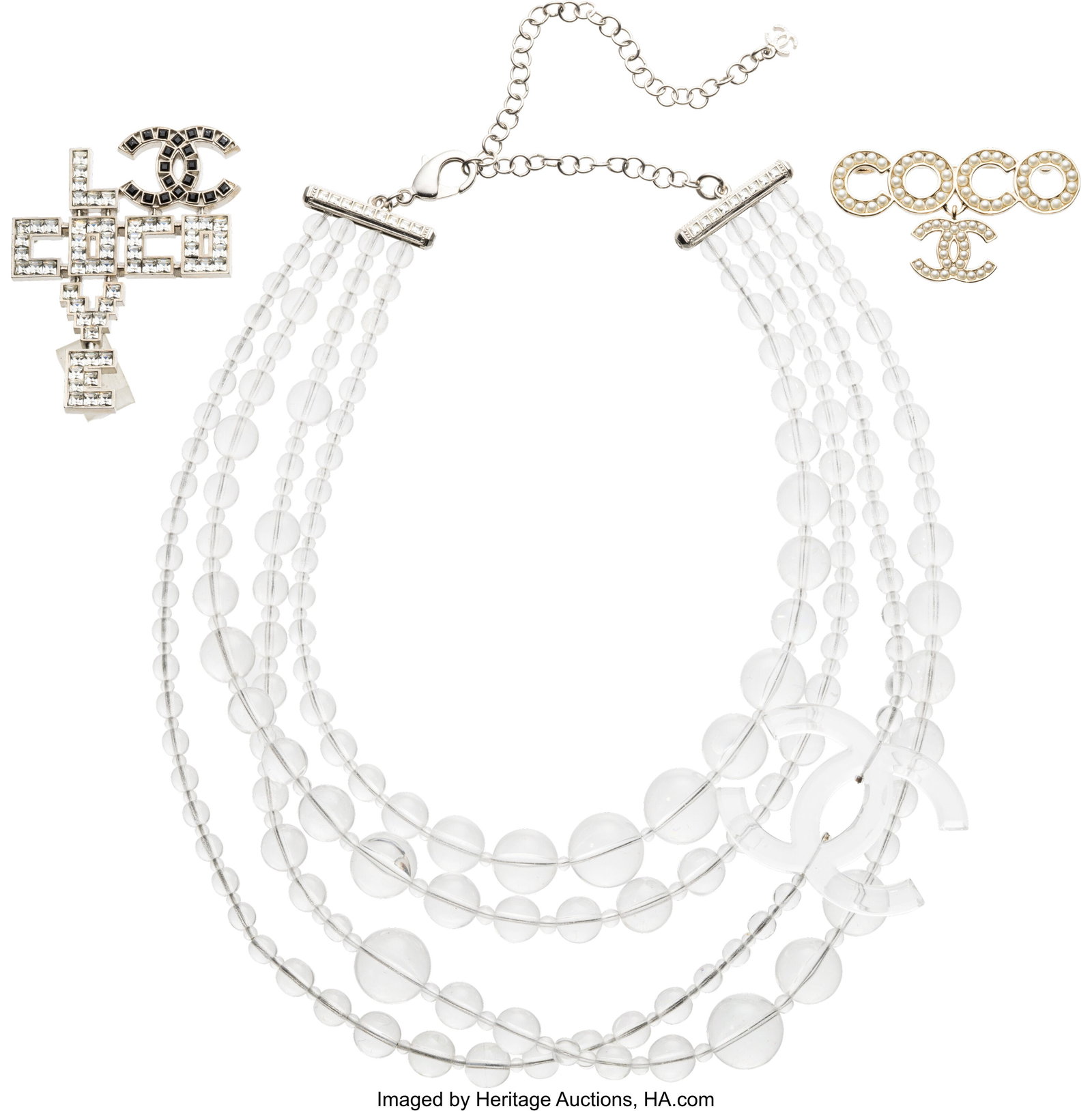 Chanel Set of Three: Necklace & Brooches See Ex: Chanel Set of Three: Necklace & Brooches See Extended Condition Report for Details. This set includes: Chanel Clear Lucite CC Bead Multi-Strand Necklace with Silver Hardware &lp